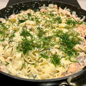 Creamy salmon pasta with fresh dill, tagliatelle, capers and rich sauce