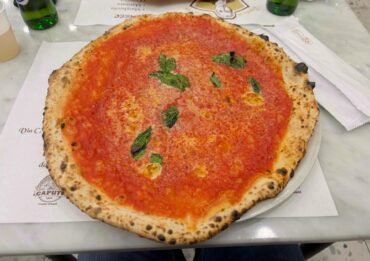 Pizza with pecorino cheese in pizzeria Da Michele in Naples, Italy